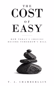 The Cost of Easy: How Today's Choices Become Tomorrow's Bill by T. A. Chamberlain book cover, a stack of dark balanced stones beneath the title on a white background